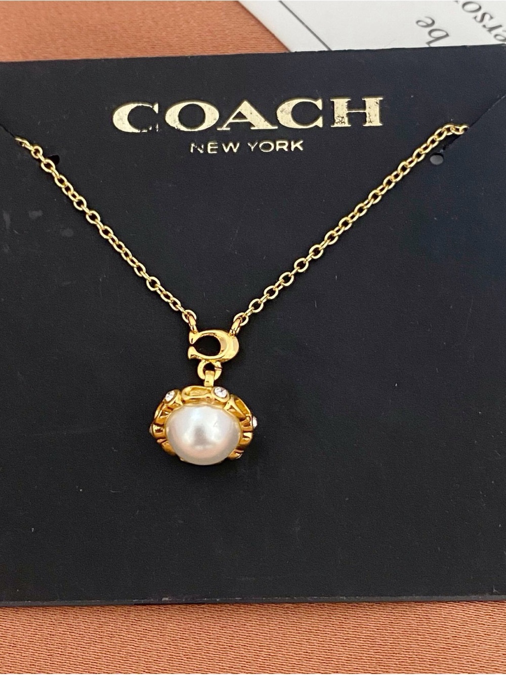 COACH Gold Pearl Charm Necklace - Gold and White